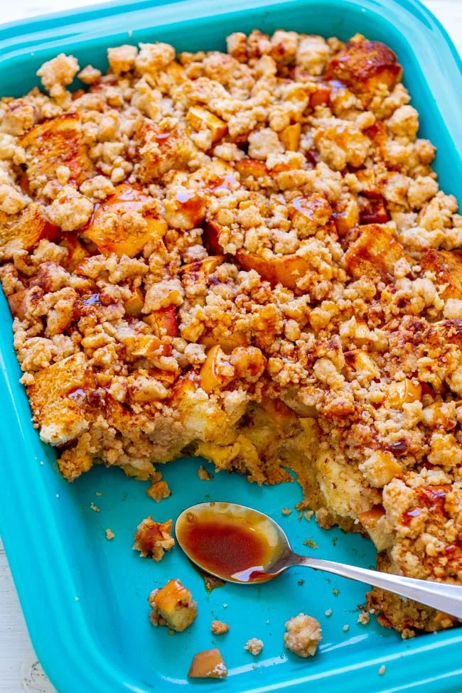 Caramel Apple French Toast Casserole topped with syrup and fresh apples