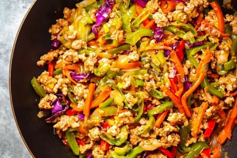 Ground Turkey Stir Fry with colorful vegetables in a skillet