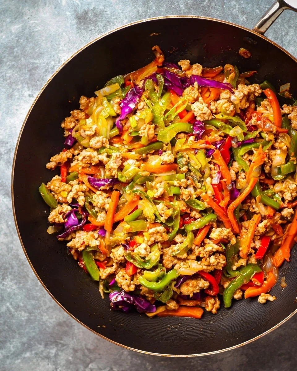 Ground Turkey Stir Fry with colorful vegetables in a skillet
