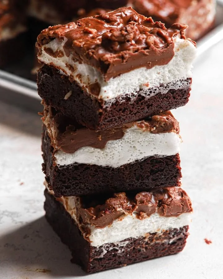 Delicious marshmallow crunch brownie bars on a plate