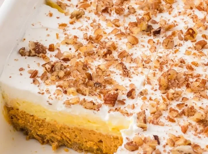 Delicious pumpkin cheesecake layered dessert with creamy texture and autumn flavors.