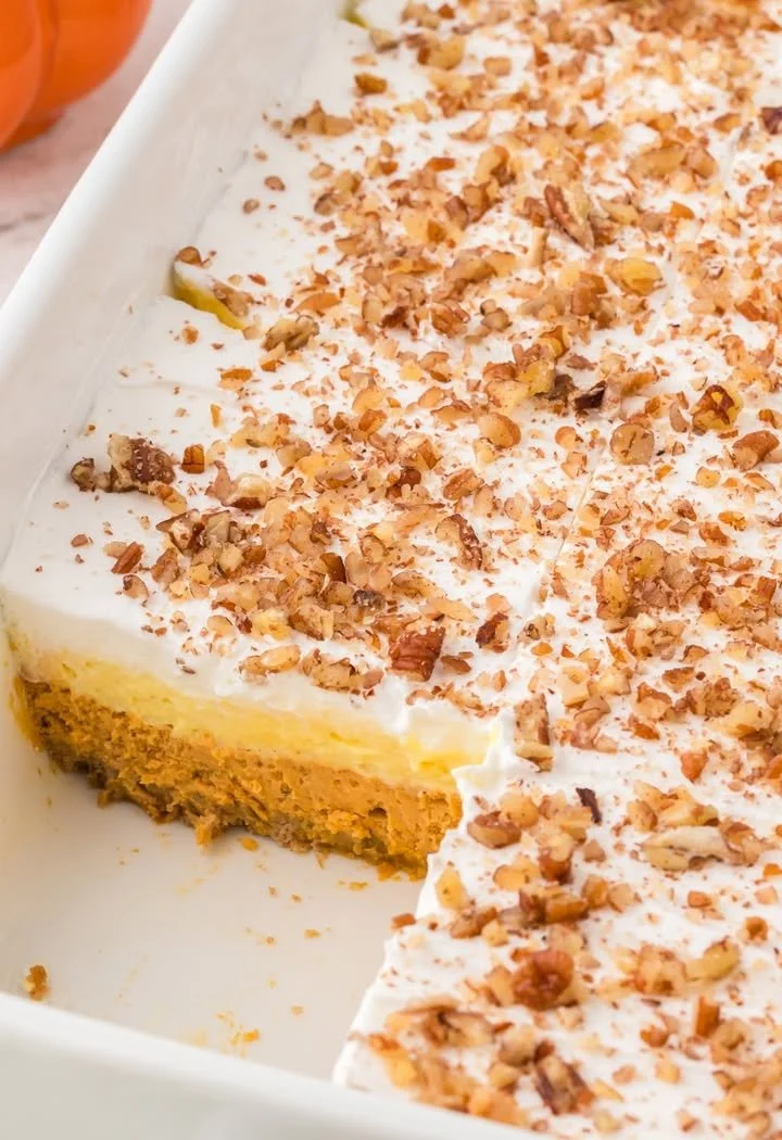Delicious pumpkin cheesecake layered dessert with creamy texture and autumn flavors.