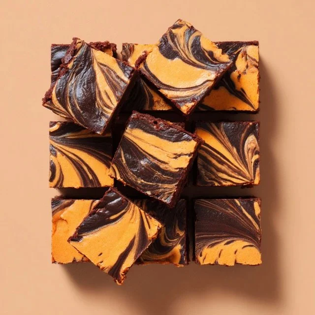 Delicious Pumpkin Swirl Brownies with rich chocolate and pumpkin flavors.